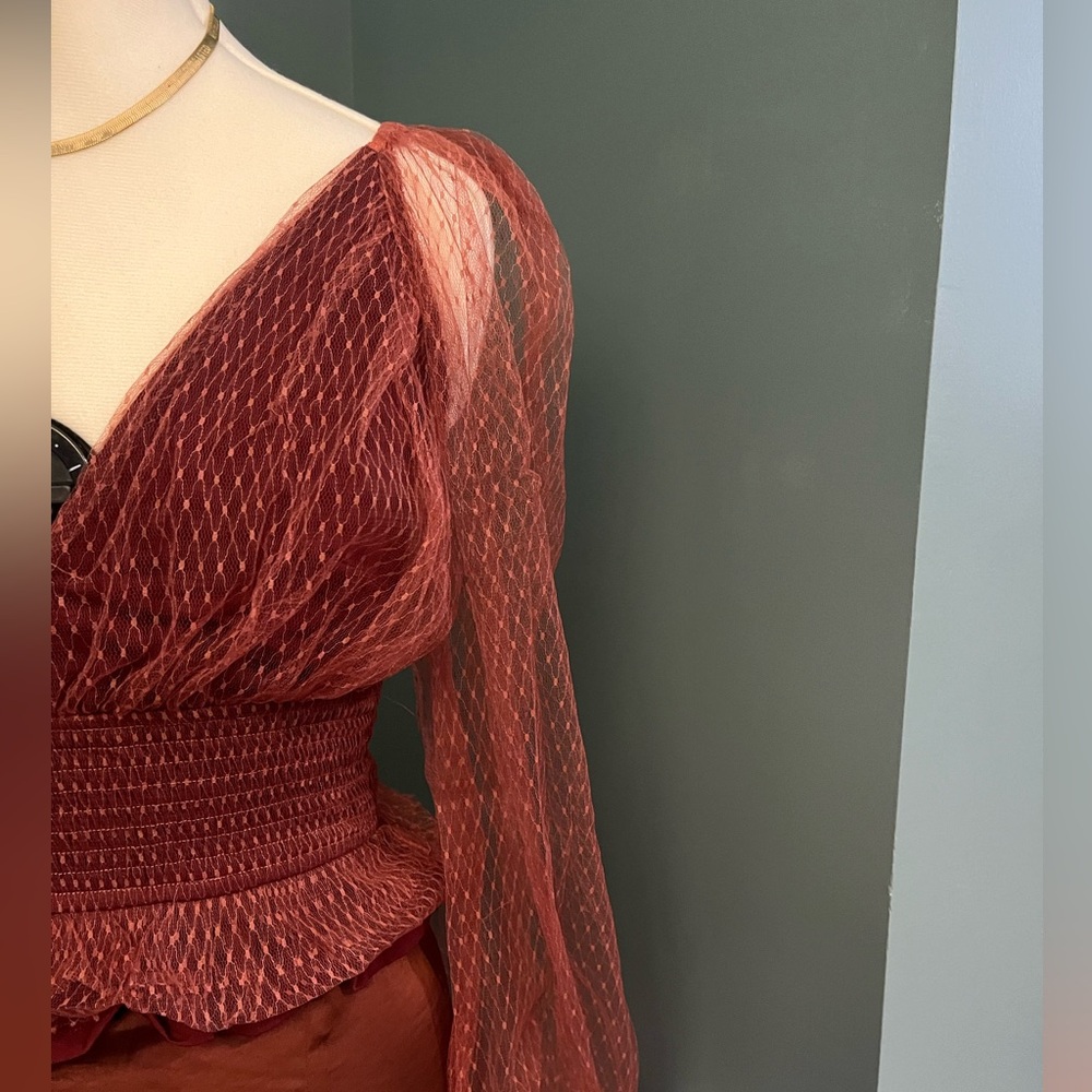 Sheer peplum Anthropologie top